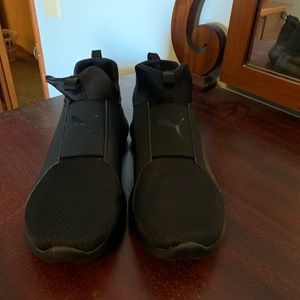 Women’s size 10 black Pumas slip on
